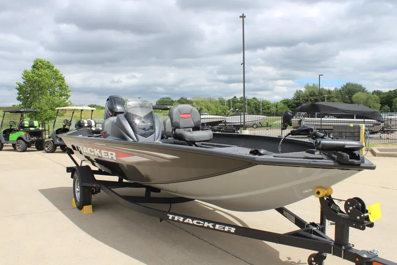Slide: The Image of 2025 Tracker Pro Team 175 Crappie Edition boat on trailer, parked outdoors. - 5
