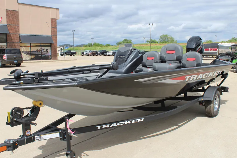 Slide: The Image of 2025 Tracker Pro Team 175 Crappie Edition boat on trailer, parked outdoors. - 7