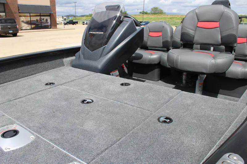 Slide: The Image of 2025 Tracker Pro Team 175 Crappie Edition boat interior with gray and red seating. - 8