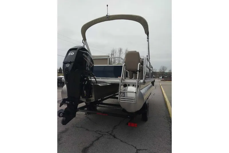 Slide: The Image of 2025 Sun Tracker Bass Buggy 16 XL Select pontoon boat with Mercury outboard motor. - 78