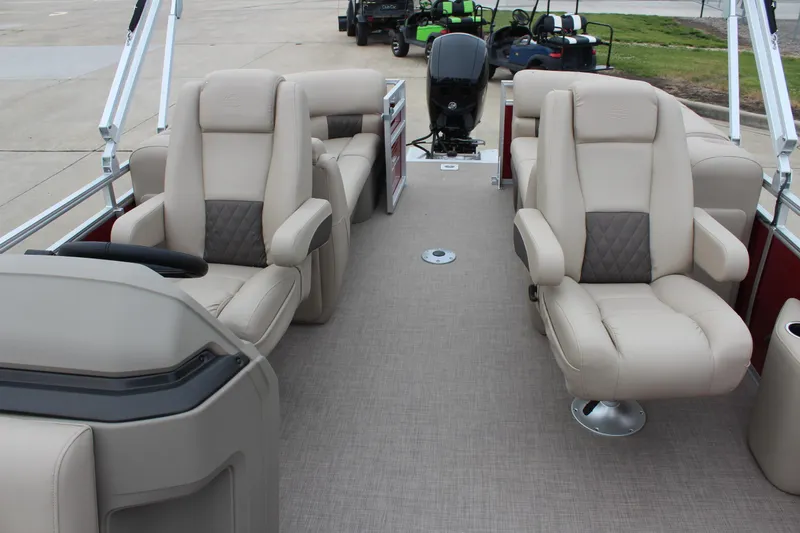 Slide: The Image of 2025 Sun Tracker Party Barge 22 DLX interior with plush seating and modern design. - 13
