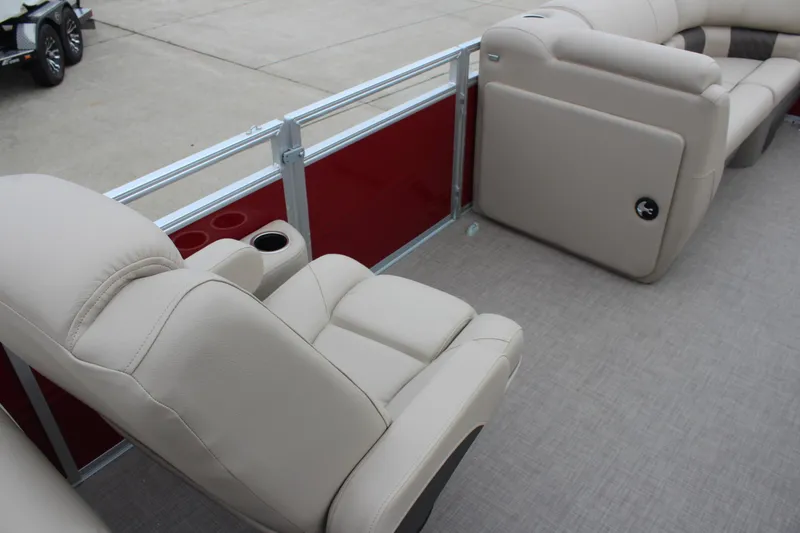 Slide: The Image of 2025 Sun Tracker Party Barge 22 DLX with beige seating and red paneling. - 15