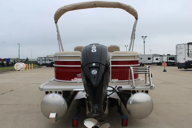 Slide: The Image of 2025 Sun Tracker Party Barge 22 DLX pontoon boat with outboard motor, rear view. - 2