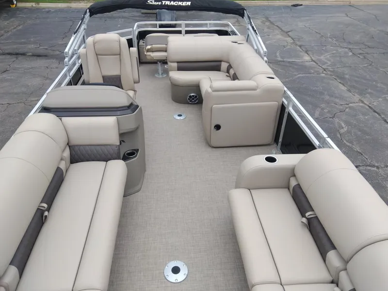 Slide: The Image of 2025 Sun Tracker SportFish 22 DLX pontoon boat with spacious seating and modern design. - 6