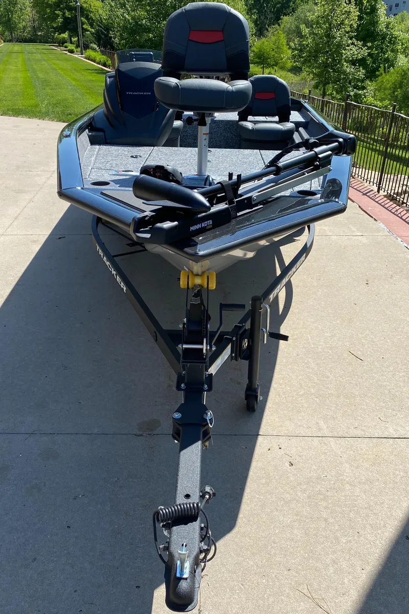 Slide: The Image of 2025 Tracker Pro Team 175 Crappie Edition boat on driveway, front view. - 2