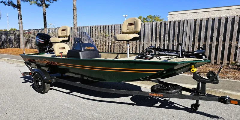 Slide: The Image of 2025 Tracker Bass Tracker Classic Limited fishing boat on trailer, parked outdoors. - 3