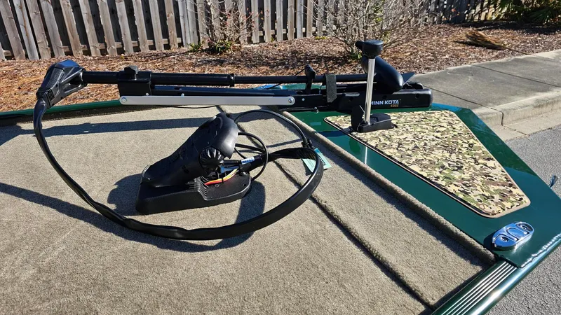 Slide: The Image of 2025 Tracker Bass Tracker Classic Limited boat with trolling motor on deck. - 6