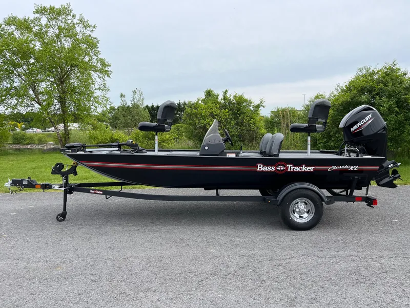 The Image of 2025 Tracker Bass Tracker Classic XL boat on trailer, parked outdoors. - 0