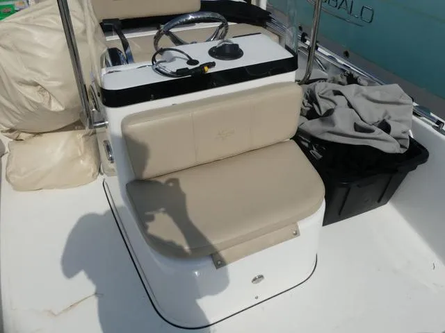 Slide: The Image of 2017 Sea Pro 172 boat interior with beige seating and steering console. - 10