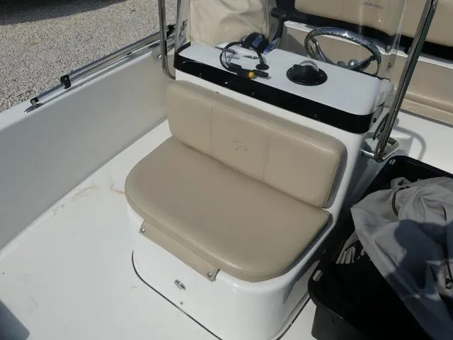 Slide: The Image of 2017 Sea Pro 172 boat interior with beige seating and steering console. - 11