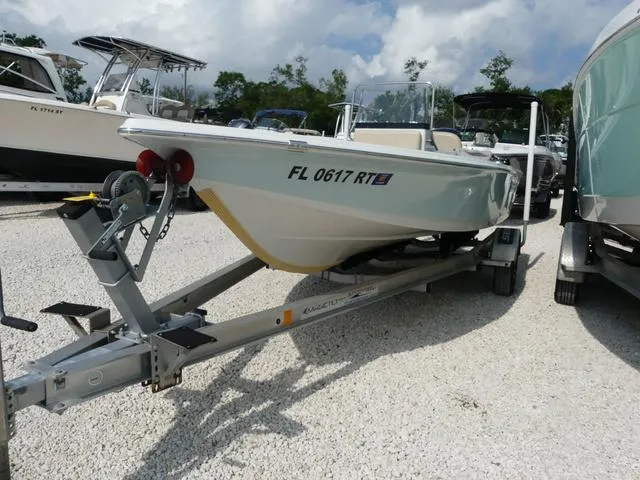 Slide: The Image of 2017 Sea Pro 172 boat on trailer, parked on gravel, surrounded by other boats. - 3
