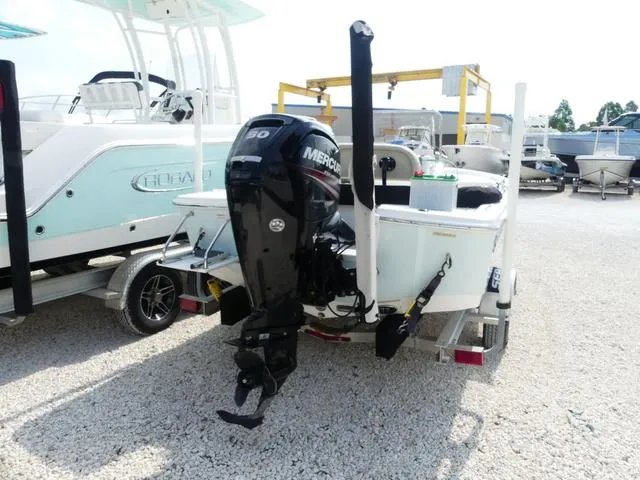 Slide: The Image of 2017 Sea Pro 172 boat with Mercury outboard motor on a trailer in a marina. - 5