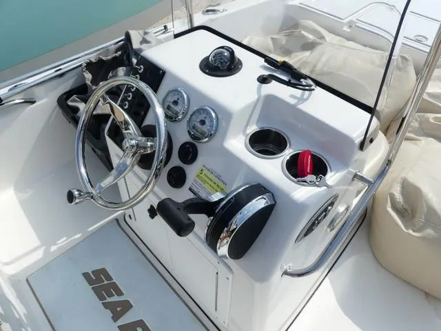 Slide: The Image of 2017 Sea Pro 172 boat console with steering wheel, gauges, and controls. - 6