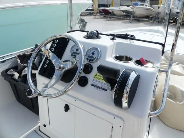 Slide: The Image of 2017 Sea Pro 172 boat console with steering wheel and gauges. - 7