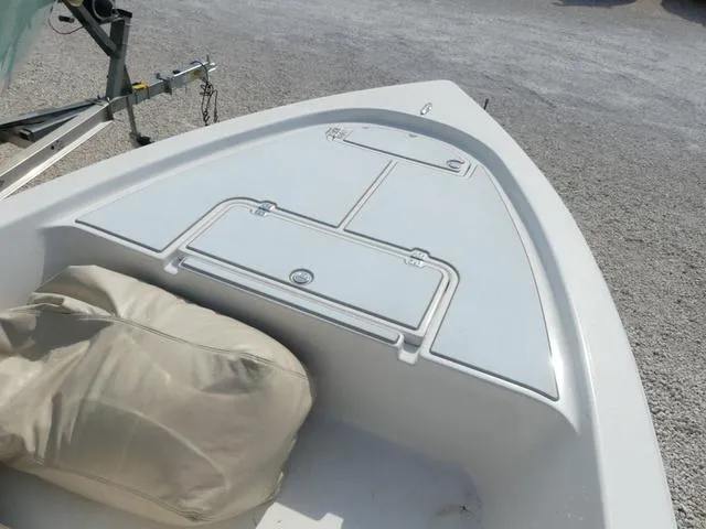 Slide: The Image of 2017 Sea Pro 172 boat bow with storage compartments and beige cover. - 9