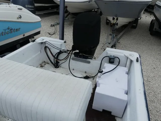 Slide: The Image of 2008 KenCraft Boats 1860 SKIFF, rear view with motor and seating area. - 10