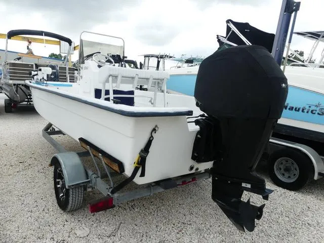 Slide: The Image of 2008 KenCraft Boats 1860 SKIFF on trailer, outboard motor covered, parked on gravel. - 4