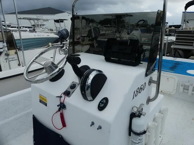 Slide: The Image of 2008 KenCraft Boats 1860 SKIFF console with steering wheel and controls. - 7