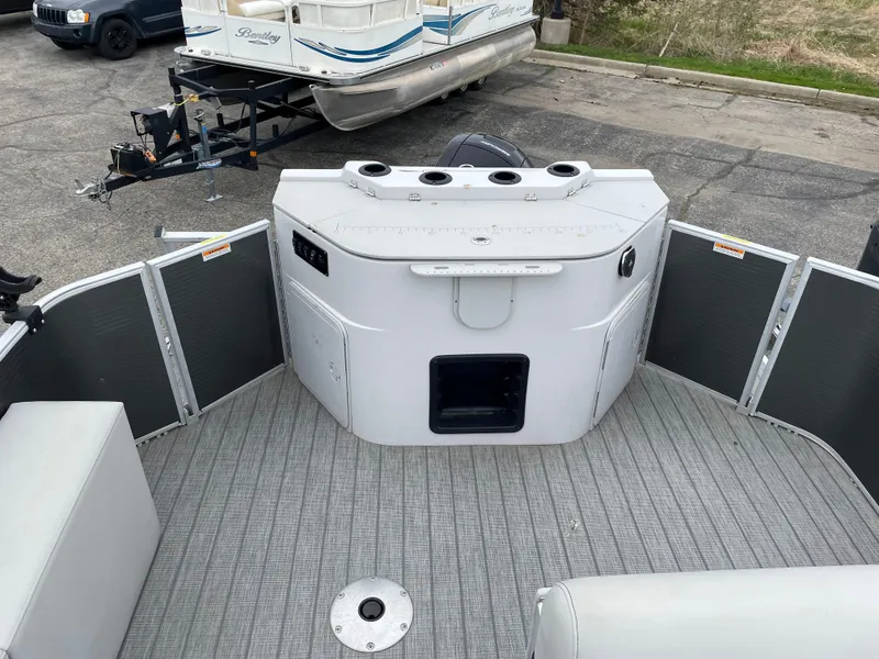 Slide: The Image of 2022 Godfrey Sweetwater 2286 FS boat interior with seating and storage compartments. - 13