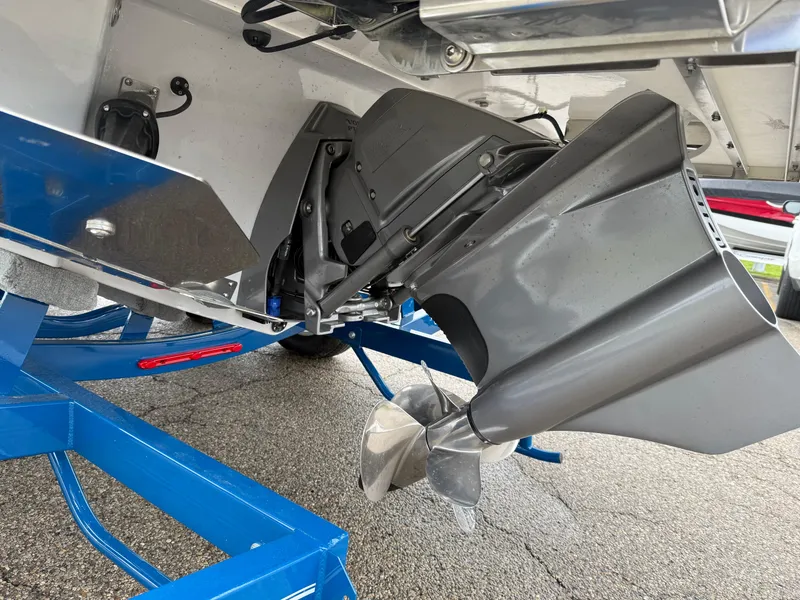 Slide: The Image of 2025 Regal LS4 Surf boat propeller and drive system on a blue trailer. - 16