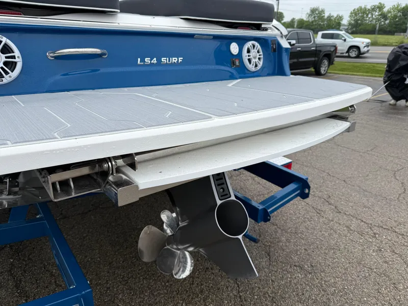 Slide: The Image of 2025 Regal LS4 Surf boat rear view with propeller and swim platform. - 18