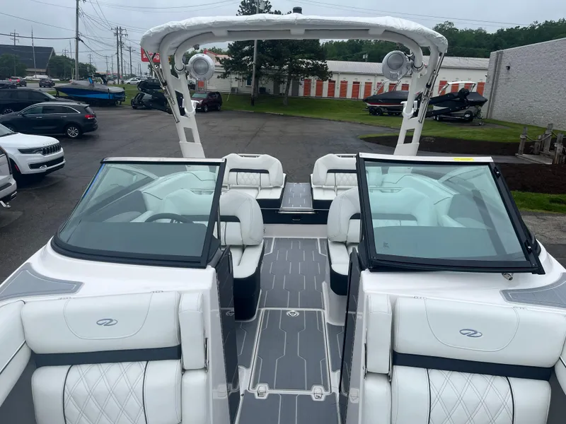 Slide: The Image of 2025 Regal LS4 Surf boat with sleek interior and modern design. - 6