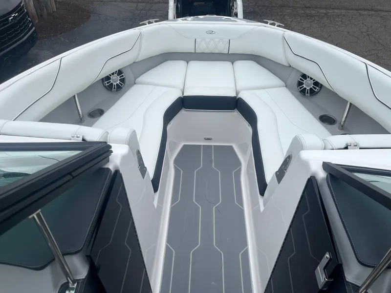 Slide: The Image of 2025 Regal LS4 Surf boat interior with white and black seating, modern design. - 7