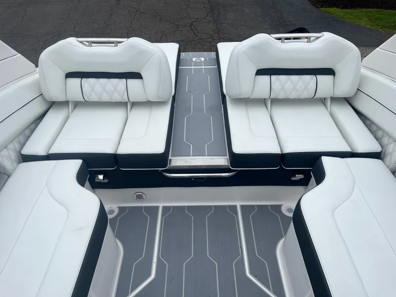 Slide: The Image of 2025 Regal LS4 Surf boat interior with luxurious white seating and modern design. - 8