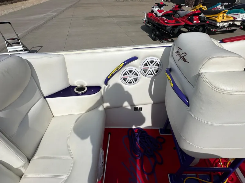 Slide: The Image of 2004 Cigarette 38 Top Gun boat interior with white seating and audio speakers. - 10