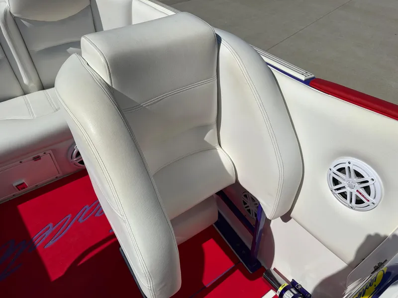 Slide: The Image of 2004 Cigarette 38 Top Gun boat interior with white seating and red carpet. - 12