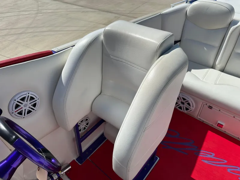 Slide: The Image of 2004 Cigarette 38 Top Gun boat interior with white seats and red carpet. - 13