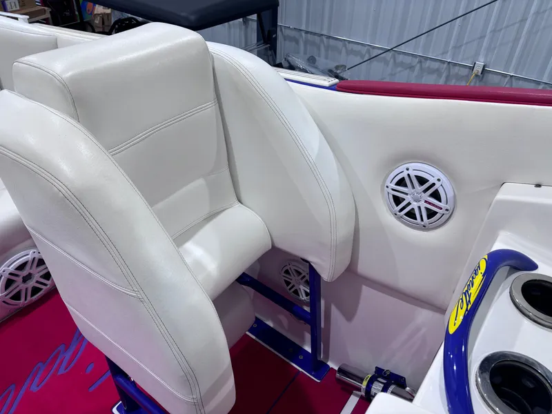 Slide: The Image of 2004 Cigarette 38 Top Gun boat interior with white seating and speaker detail. - 22