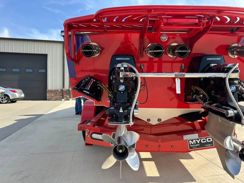 Slide: The Image of Rear view of a 2004 Cigarette 38 Top Gun boat with dual Mercury engines. - 29