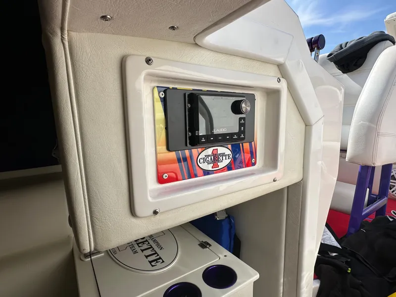 Slide: The Image of 2004 Cigarette 38 Top Gun boat interior with stereo system and branded panel. - 33