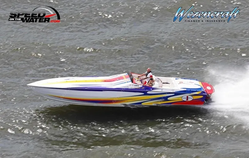 Slide: The Image of 2004 Cigarette 38 Top Gun speedboat racing on water, vibrant graphics, high-speed performance. - 36