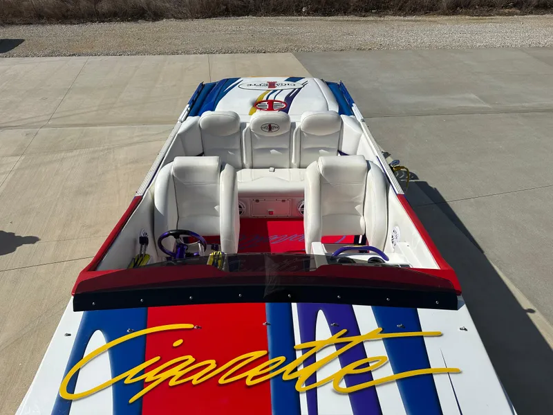 Slide: The Image of 2004 Cigarette 38 Top Gun boat with colorful interior and bold branding. - 4
