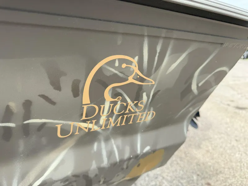 Slide: The Image of 2024 War Eagle 754LDV Sportsman boat with Ducks Unlimited logo on camouflage design. - 16