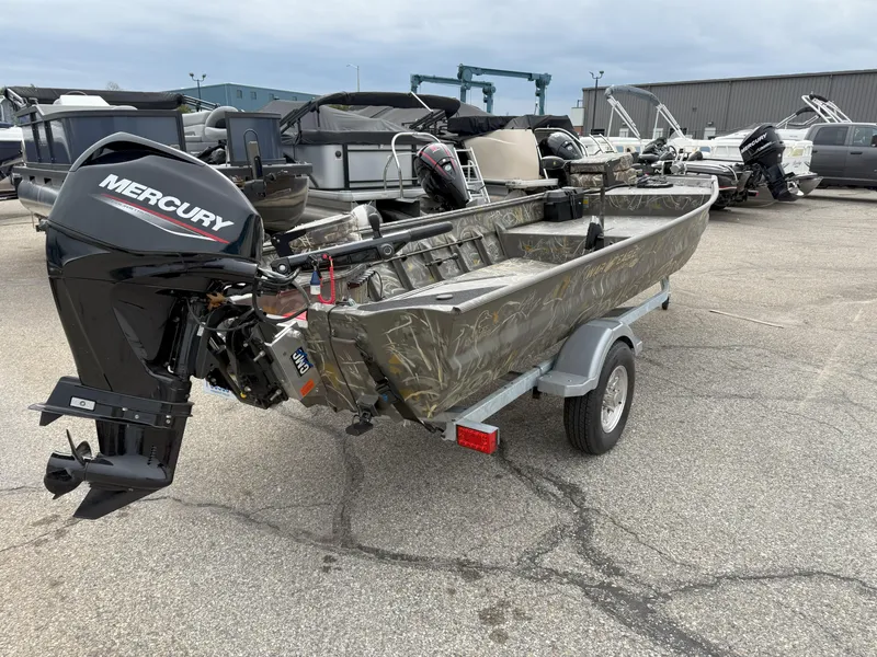 Slide: The Image of 2024 War Eagle 754LDV Sportsman boat with Mercury engine on trailer in marina. - 3