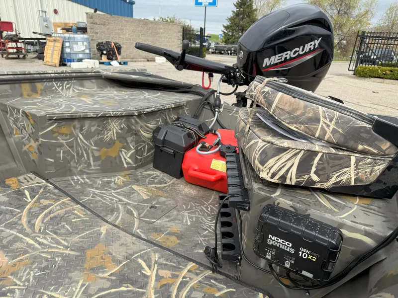 Slide: The Image of 2024 War Eagle 754LDV Sportsman boat with Mercury motor and camo interior. - 7