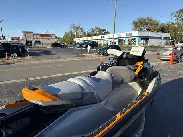 Slide: The Image of 2023 Sea-Doo Waverunner FishPro™ Trophy parked in urban setting, showcasing sleek design. - 14