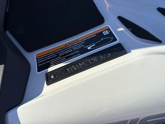 Slide: The Image of 2023 Sea-Doo FishPro™ Trophy Waverunner with warning label and identification plate. - 17