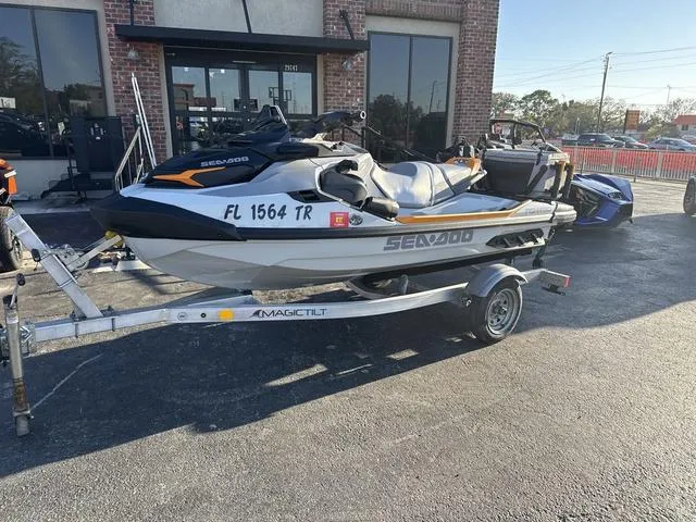 Slide: The Image of 2023 Sea-Doo FishPro™ Trophy Waverunner on trailer, parked outside a building. - 3
