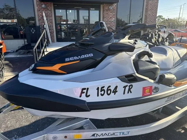 Slide: The Image of 2023 Sea-Doo FishPro™ Trophy Waverunner on trailer, parked outside a building. - 4