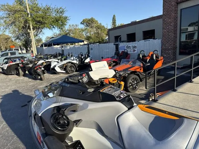 Slide: The Image of 2023 Sea-Doo Waverunner FishPro™ Trophy parked outside dealership with other vehicles. - 8