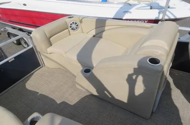 Slide: The Image of 2014 Bennington 2275 GCW boat interior with beige seating and cup holders. - 10