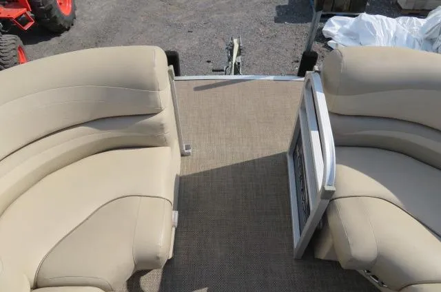 Slide: The Image of 2014 Bennington 2275 GCW pontoon boat interior with beige seating and carpeted floor. - 17