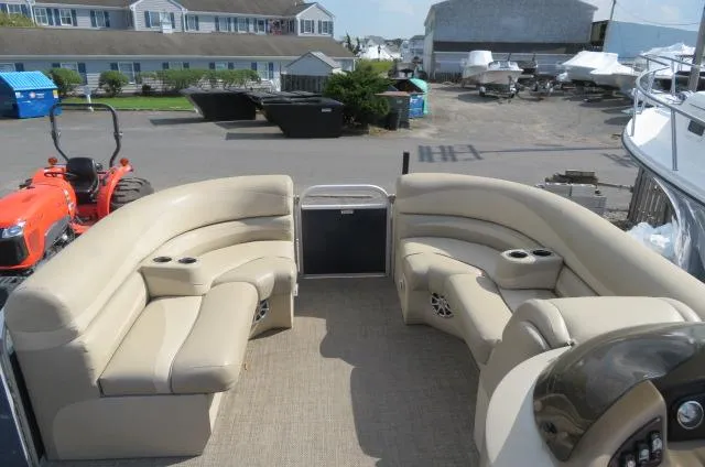 Slide: The Image of 2014 Bennington 2275 GCW pontoon boat with beige seating, docked in a marina. - 19