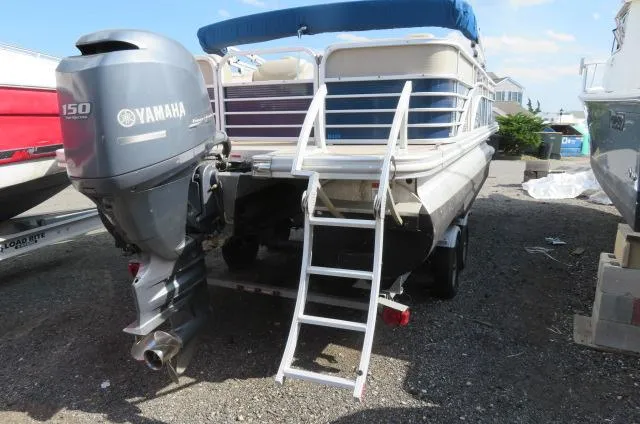 Slide: The Image of 2014 Bennington 2275 GCW pontoon boat with Yamaha 150 outboard motor and boarding ladder. - 4