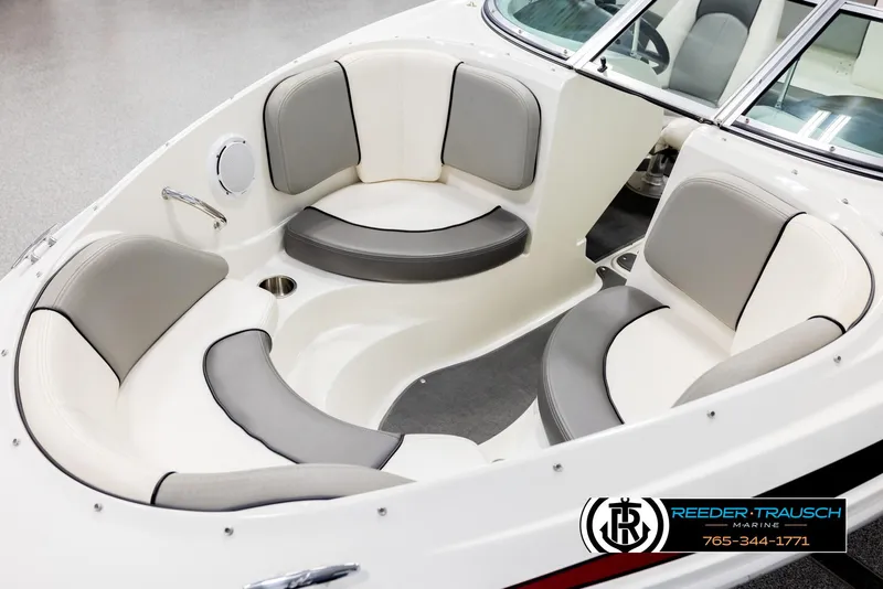 Slide: The Image of 2011 Sea Ray 185 Sport boat interior with gray and white seating. - 10