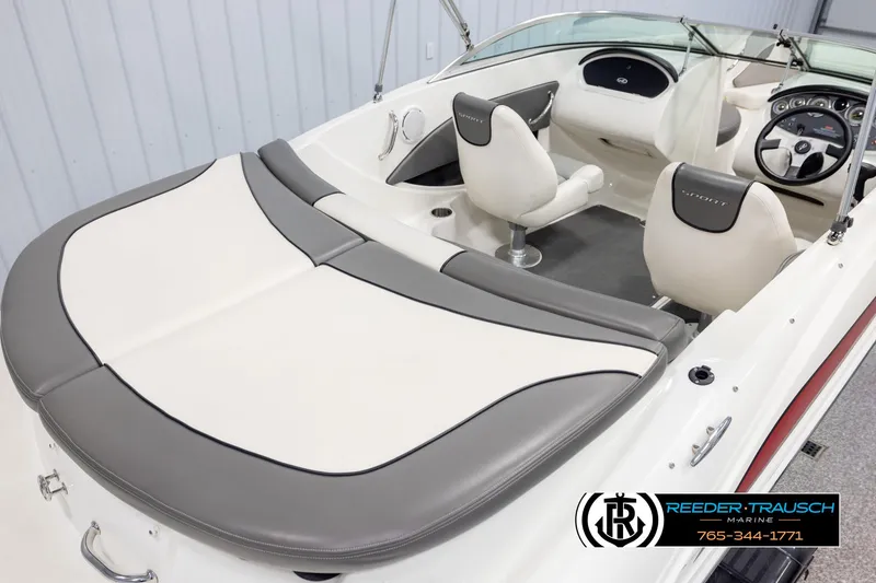 Slide: The Image of 2011 Sea Ray 185 Sport boat interior with white and gray seating. - 12